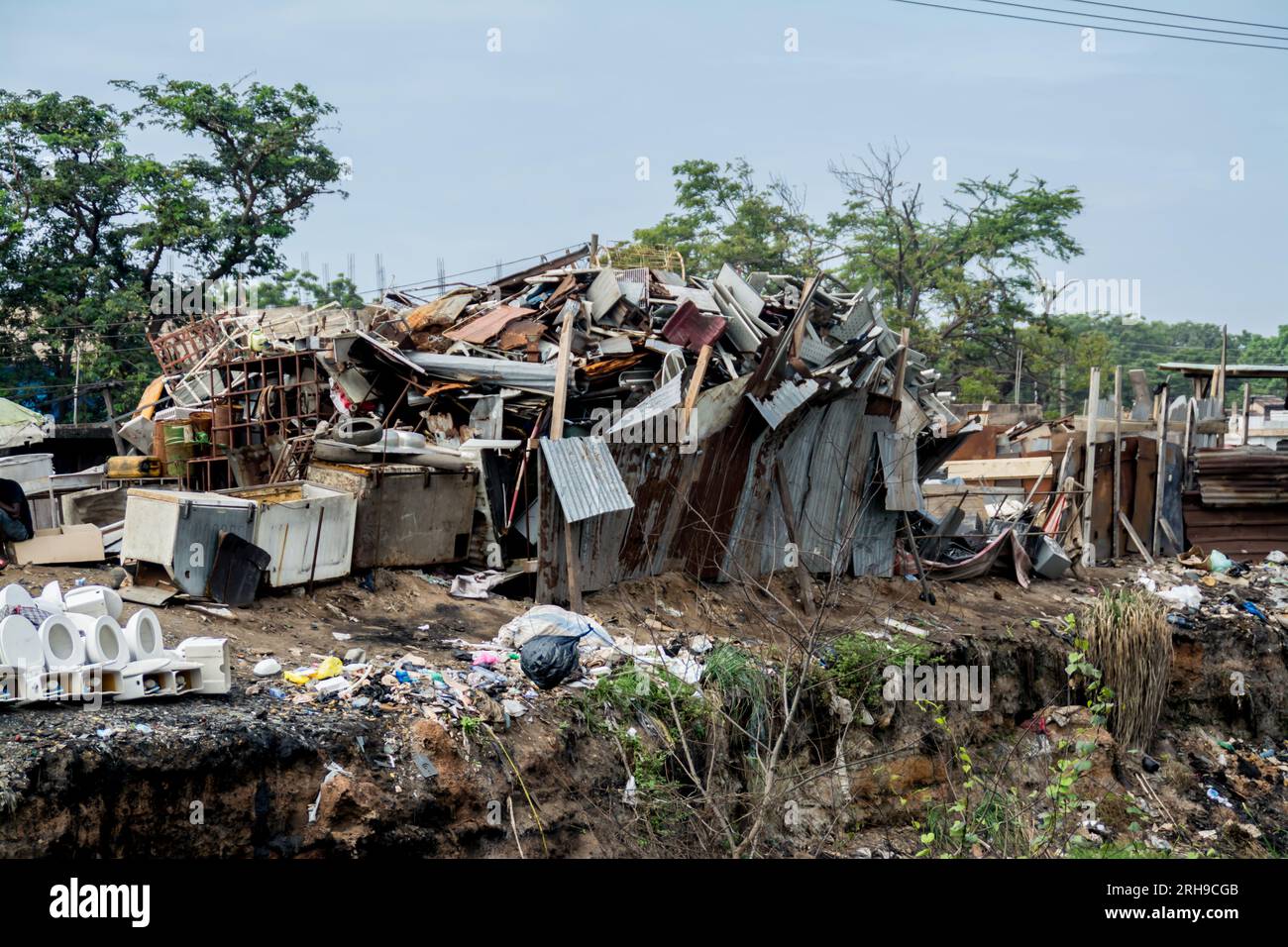 Electronic scrap processing in Agbogbloshie takes place in the district of the same name in the metropolis of Accra in West African Ghana. Dump, Waste Stock Photo