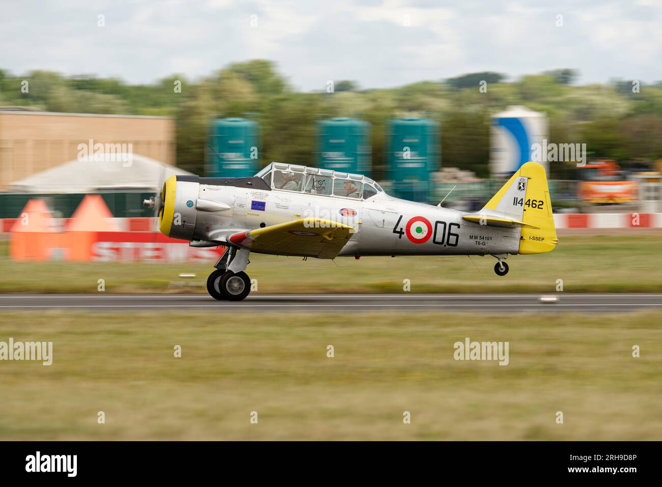 Historic North American Texan Trainer Aircraft departing RAF Fairford in Southern England after participating in the Royal International Air Tattoo. Stock Photo