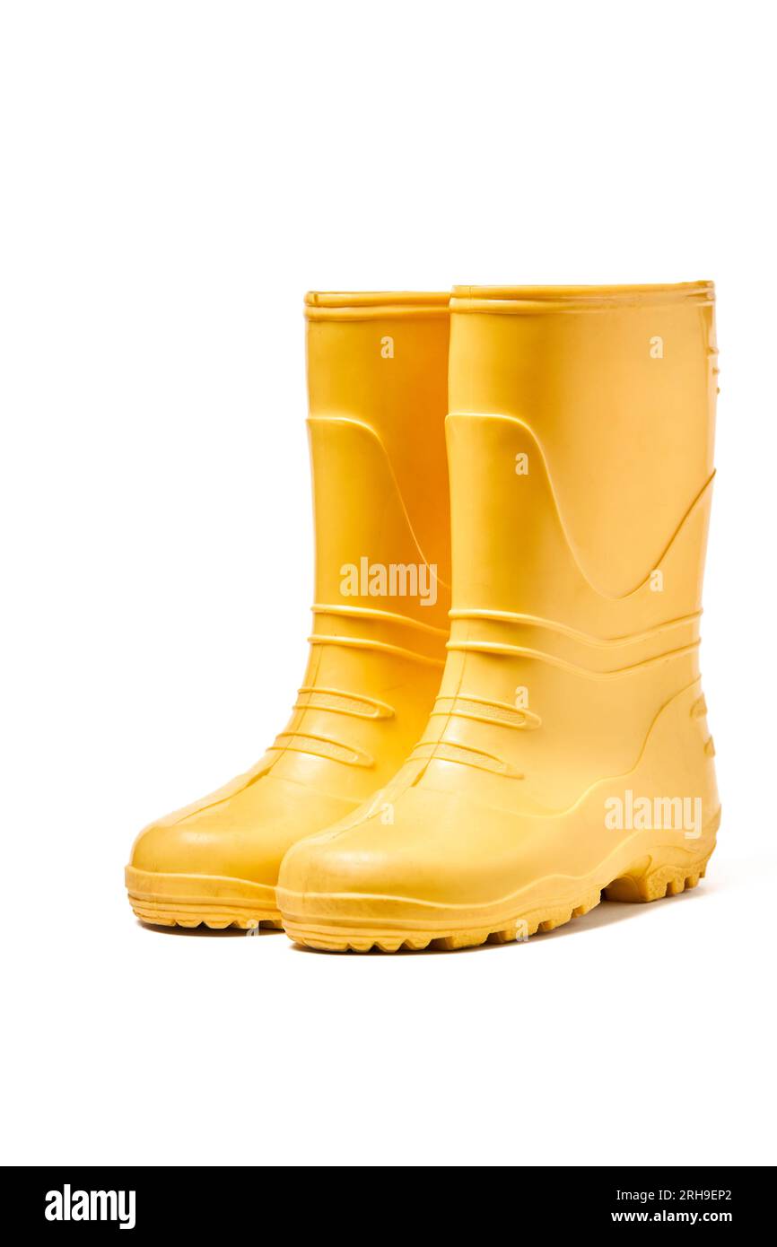 Pair of yellow rubber boots for kids isolated on white background three ...