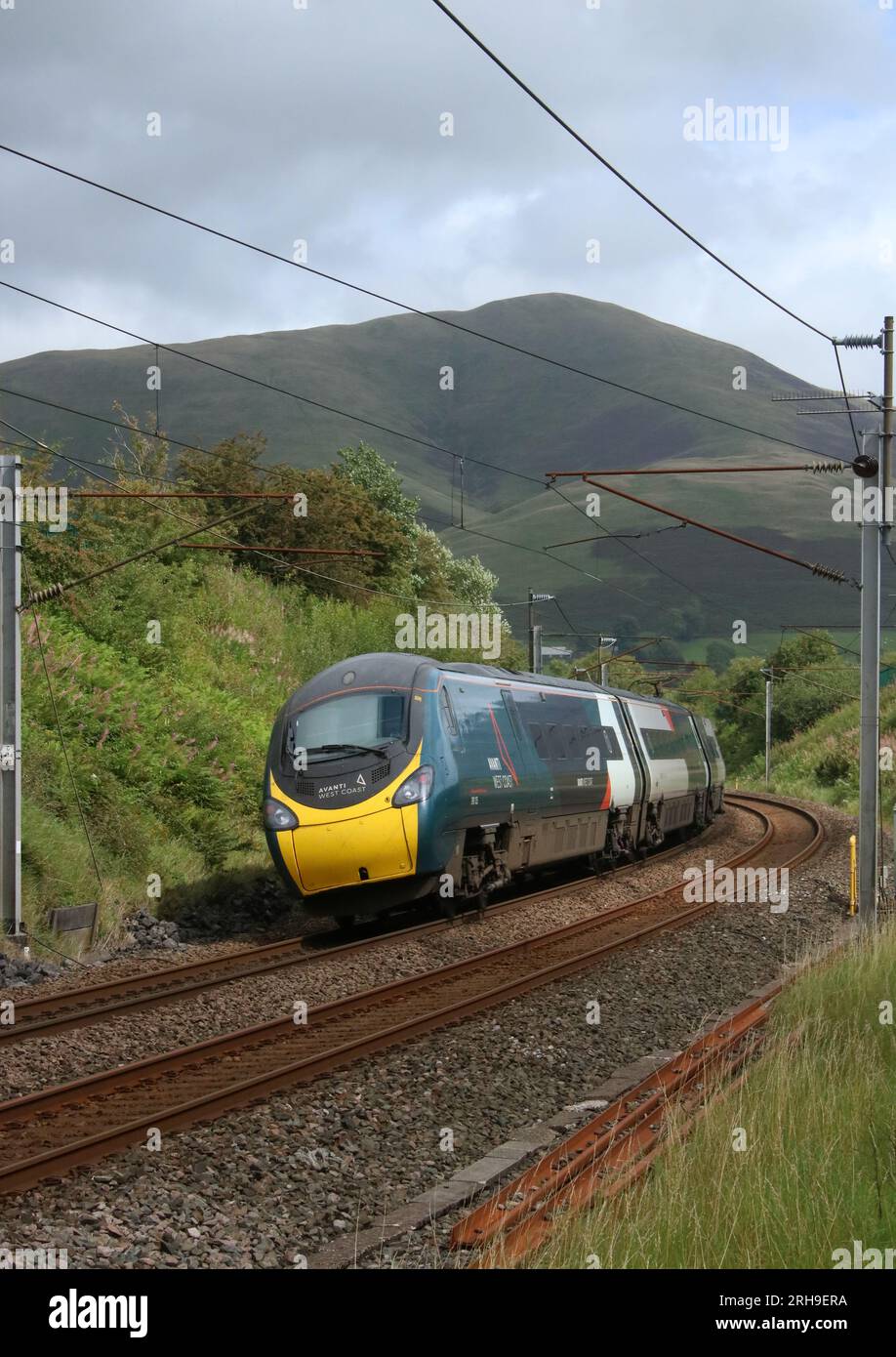 Avanti West Coast class 390 pendolino electric multiple unit, West Coast Main Line, Lowgill, Cumbria, with Anglo-Scottish service on 11th August 2023. Stock Photo