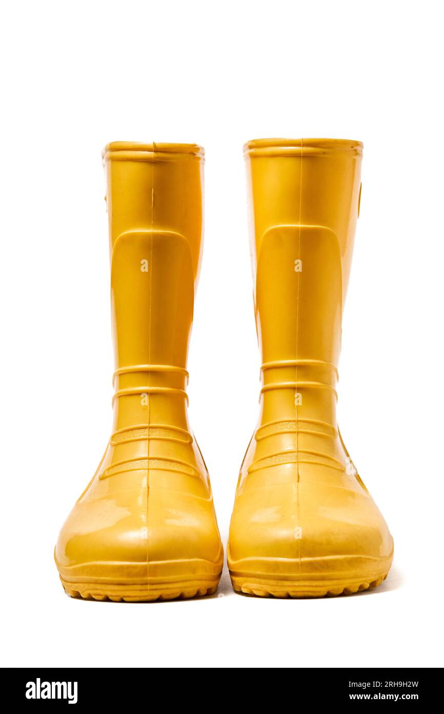 Pair of yellow rubber boots for kids isolated on white background front ...