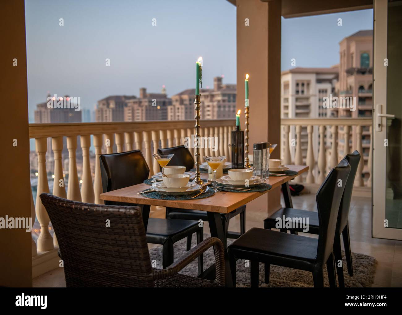 Dinner table at rooftop with sunset view at pearl Qatar. view of Peral