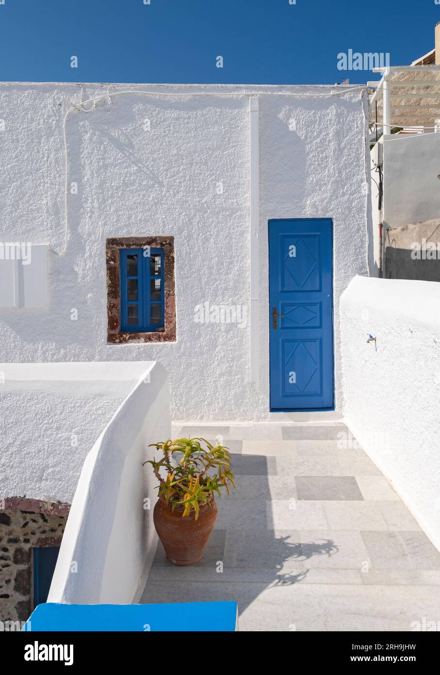 Blue door, white wall and balcony, Fira, Santorini, Greece Stock Photo