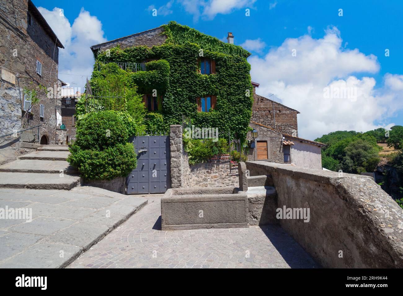 Historic charm resonates in this hillside cottage, offering a serene valley vista in Vitorchiano. Stock Photo