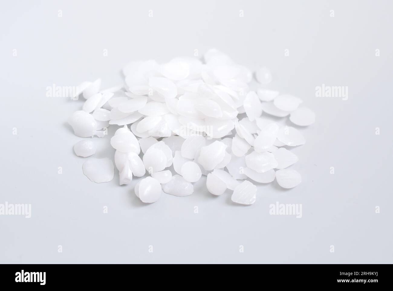 Potassium hydroxide or caustic potash on light grey background Stock