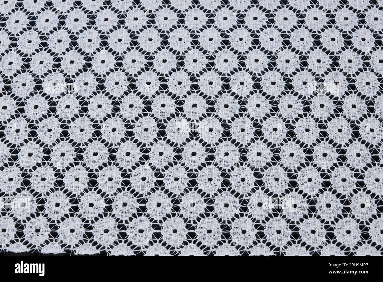 fabric texture. mesh texture. flower fabric texture. string texture, mesh cloth. black synthetic fabric. can be used as a background Stock Photo