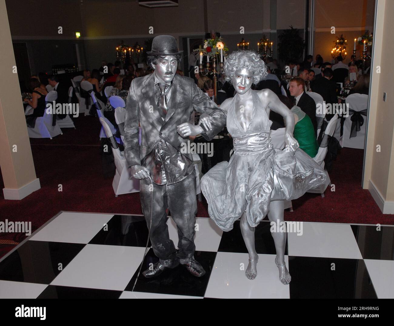 Mime artists portraying Charlie Chaplin and Marilyn Monroe while