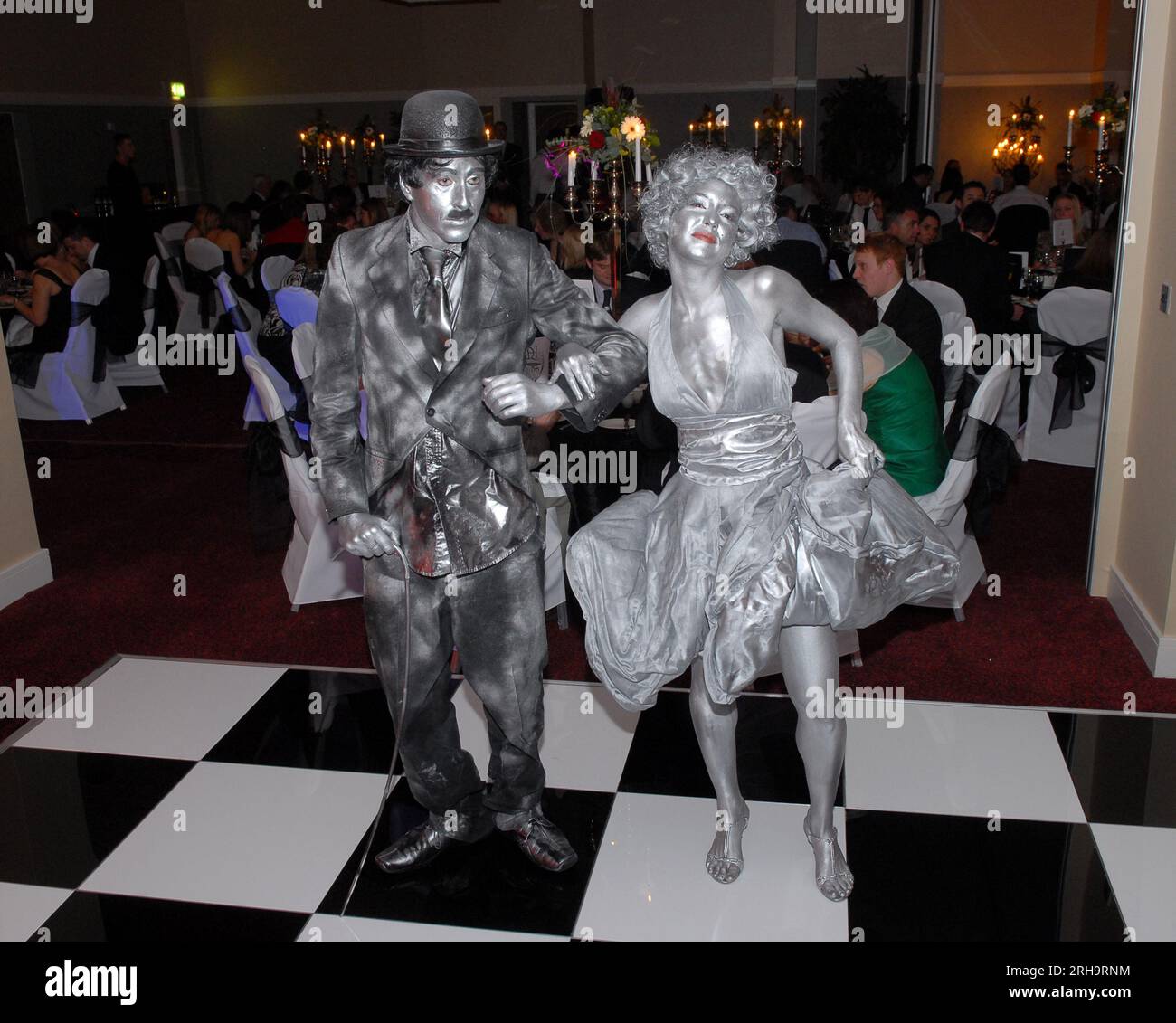 Mime artists portraying Charlie Chaplin and Marilyn Monroe while