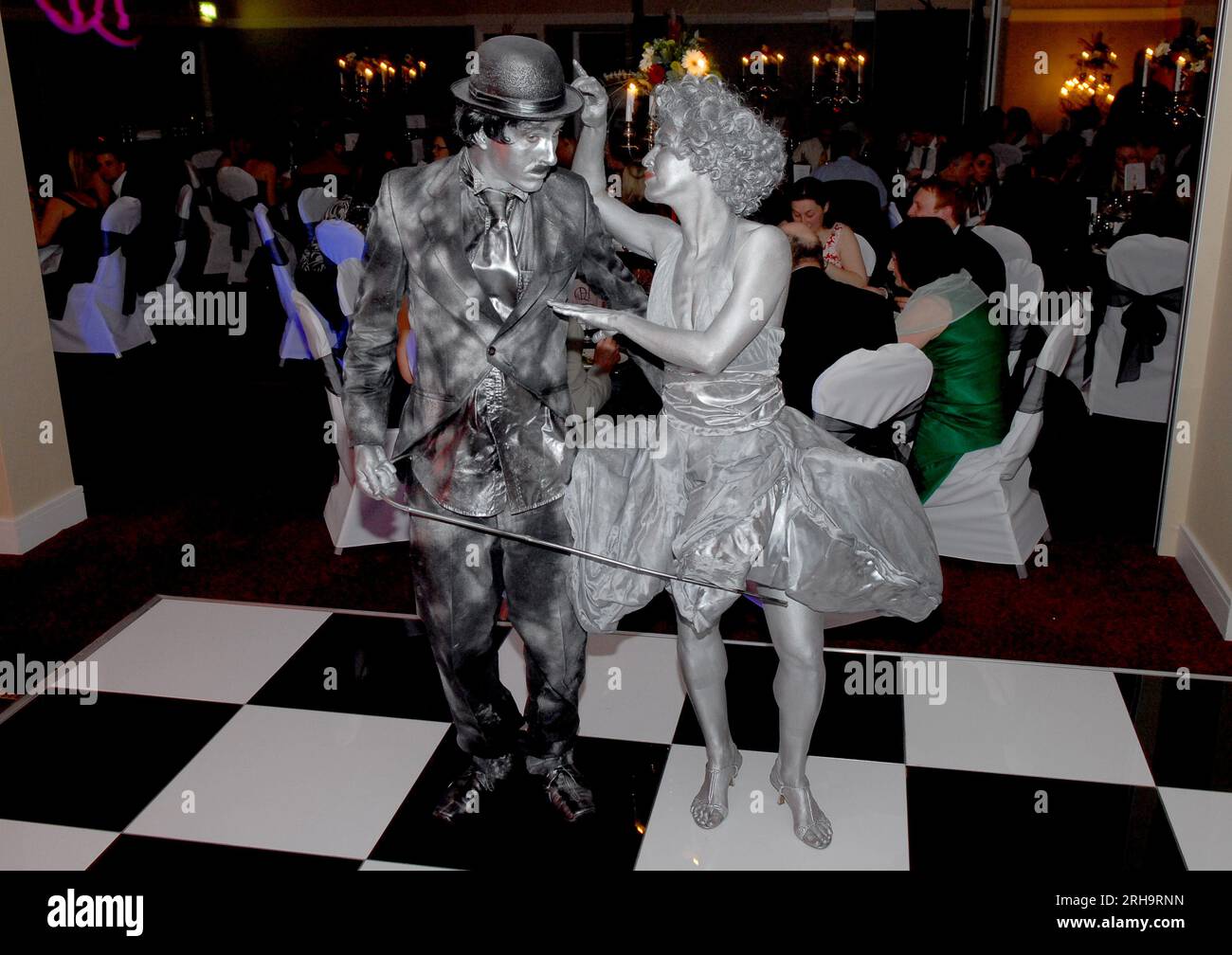 Mime artists portraying Charlie Chaplin and Marilyn Monroe while