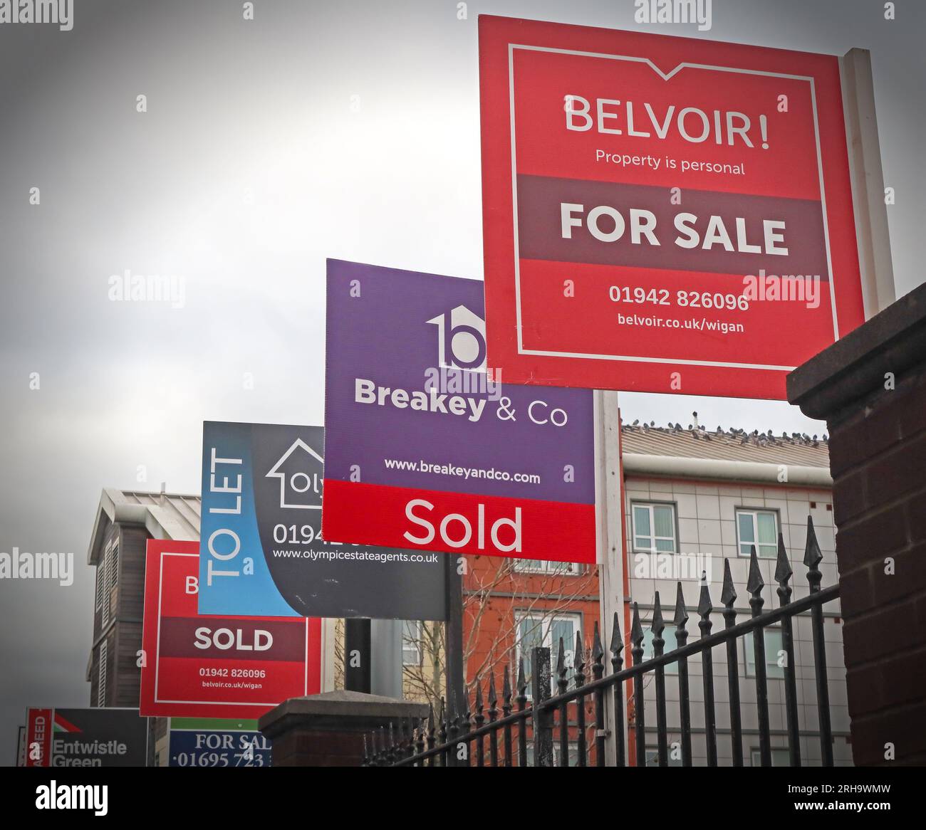 Belvoir, Breakey & Co, for sale, to let signs, flats in an unaffordable housing market, Wigan, Greater Manchester, Lancs, England, UK, WN1 Stock Photo