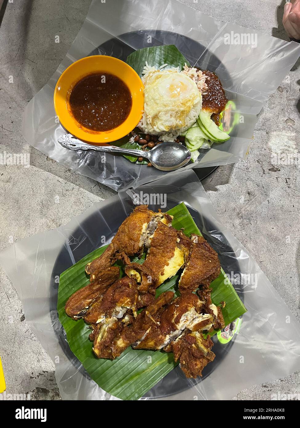 Crispy fried chicken with egg rice and cucumber,Kuala Lumpur , Malaysia Stock Photo