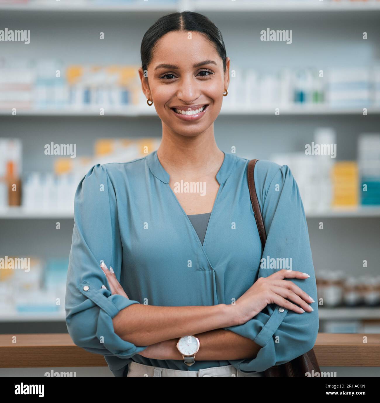 Woman, portrait and pharmacy, arms crossed and patient in store for pharmaceutical drugs with prescription. Healthcare, face and happy with confidence Stock Photo