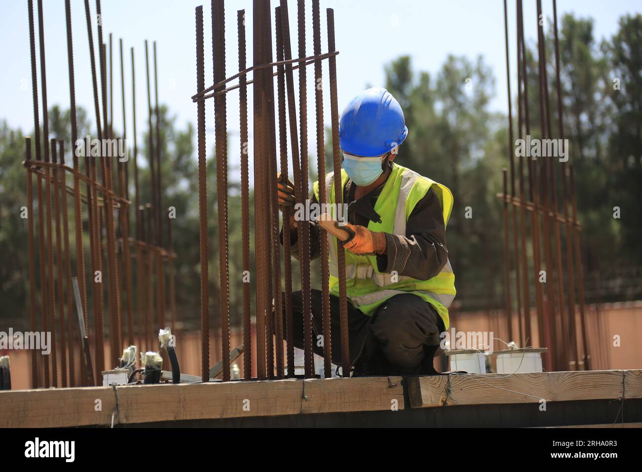 Kabul, Afghanistan. 13th Aug, 2023. An Afghan employee works at the construction site of a China-funded housing complex in Kabul, Afghanistan, Aug. 13, 2023. TO GO WITH 'Feature: Afghan staffer makes big stride in China-invested project' Credit: Saifurahman Safi/Xinhua/Alamy Live News Stock Photo