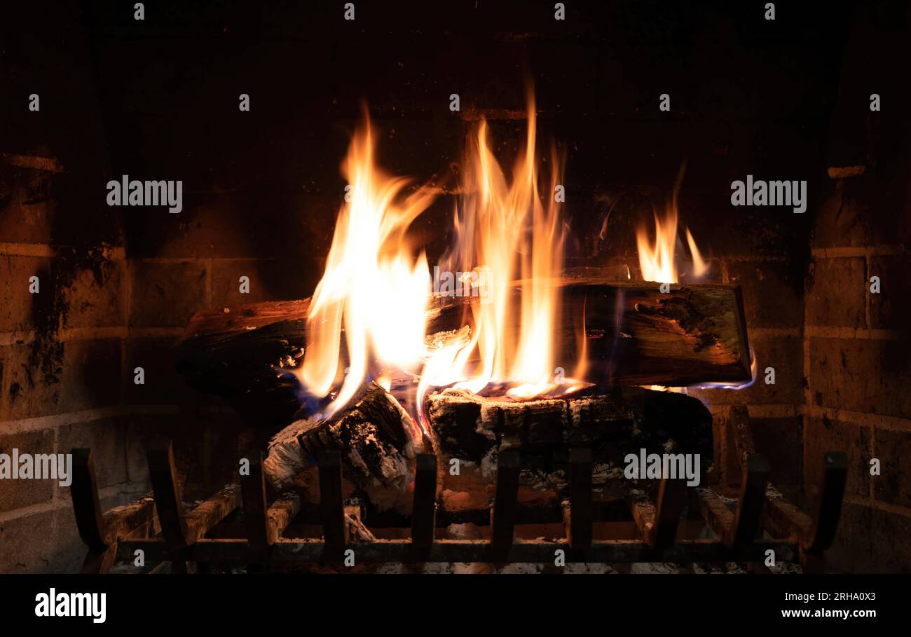 A closeup shot of pieces of wood burning inside old metal oven Stock Photo  - Alamy