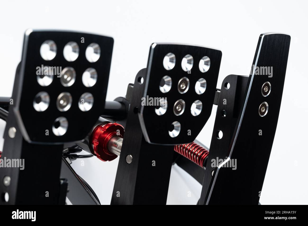 Three black metal car pedals isolated on white studio background Stock