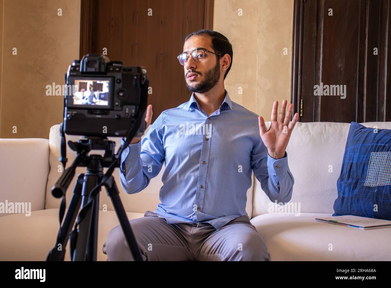 Young arabic man conducting a seminar from home Stock Photo