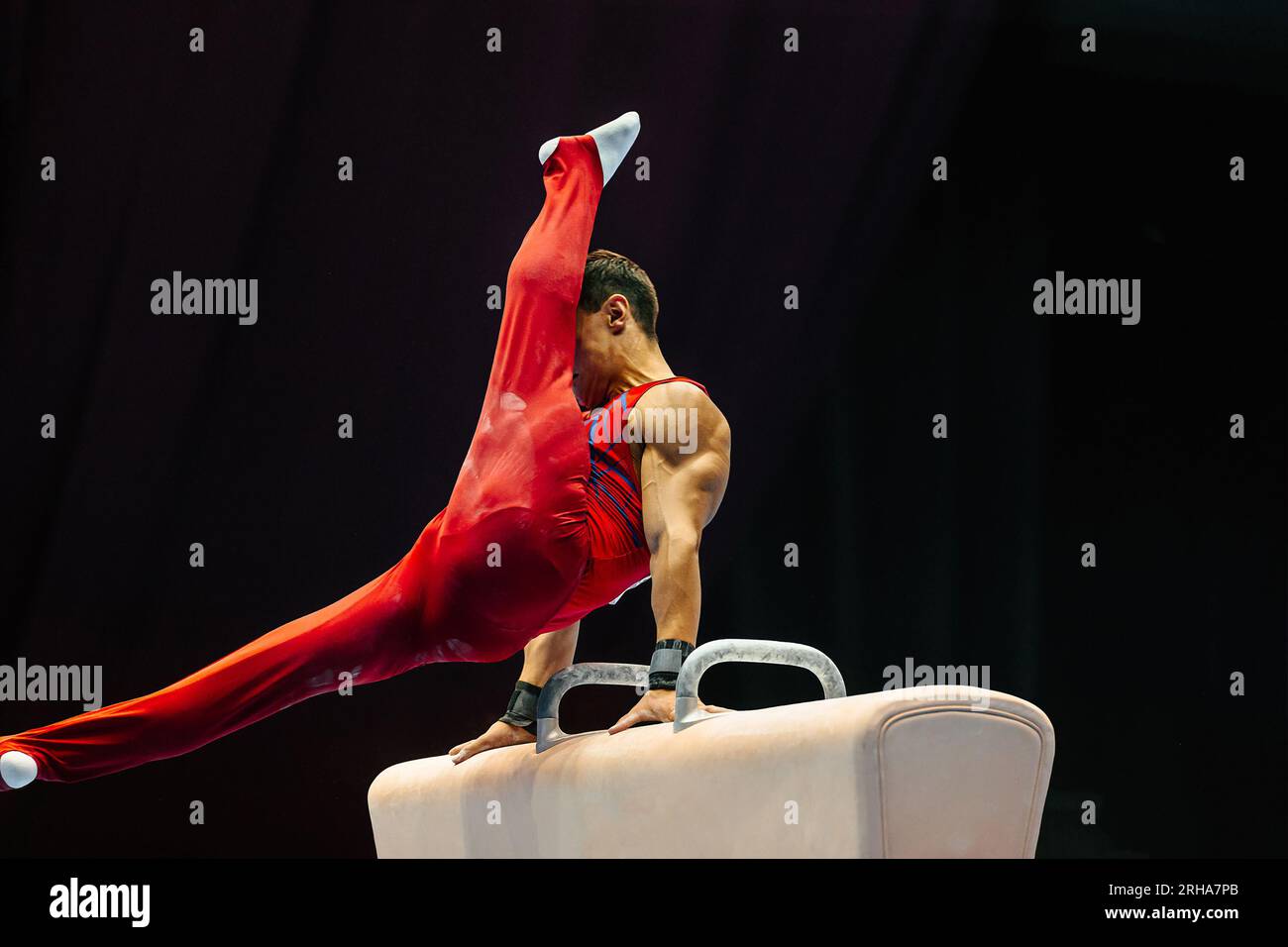 gymnast exercise pommel horse in championship gymnastics, support with
