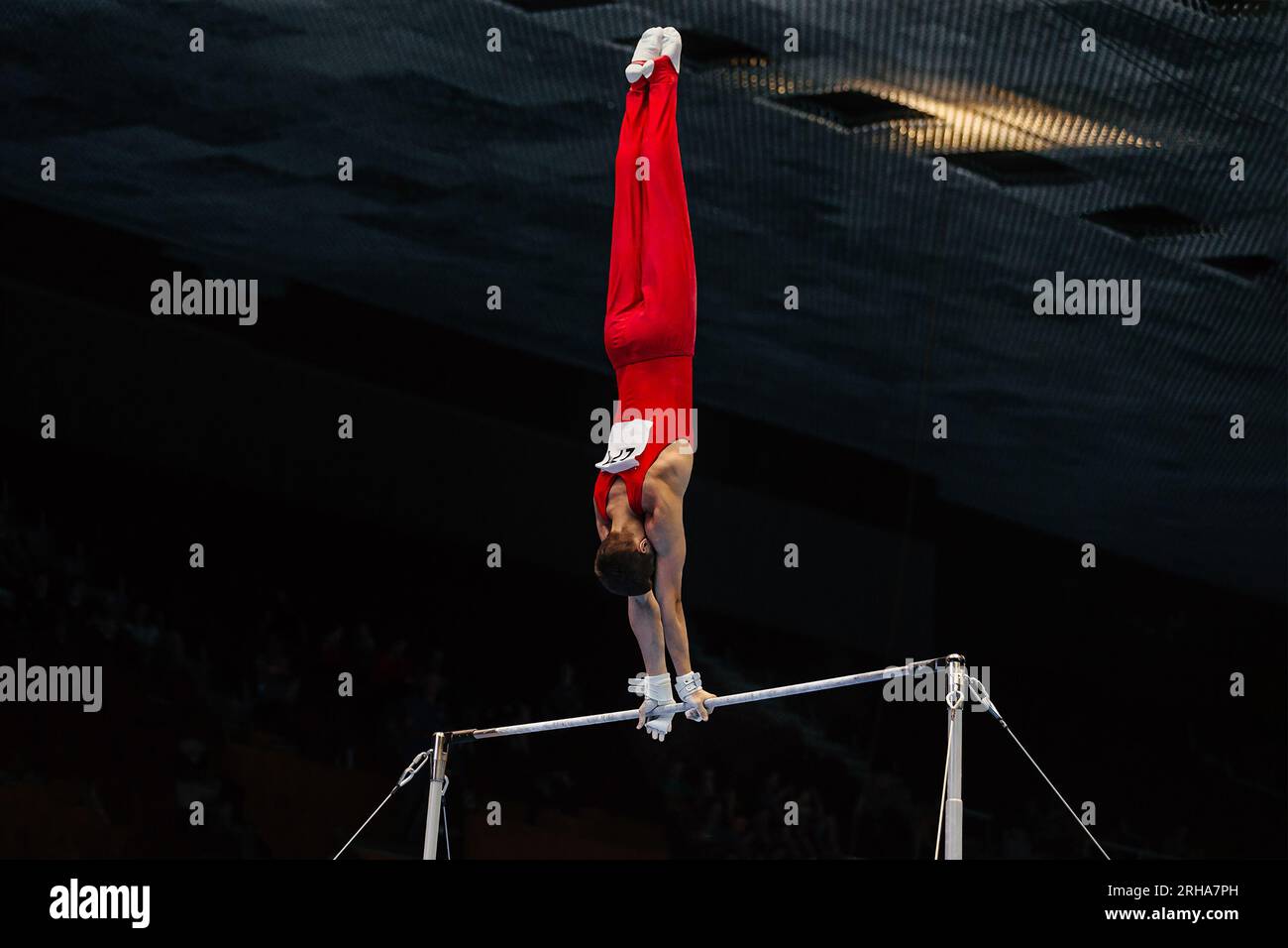 gymnast exercise horizontal bar in championship gymnastics, element