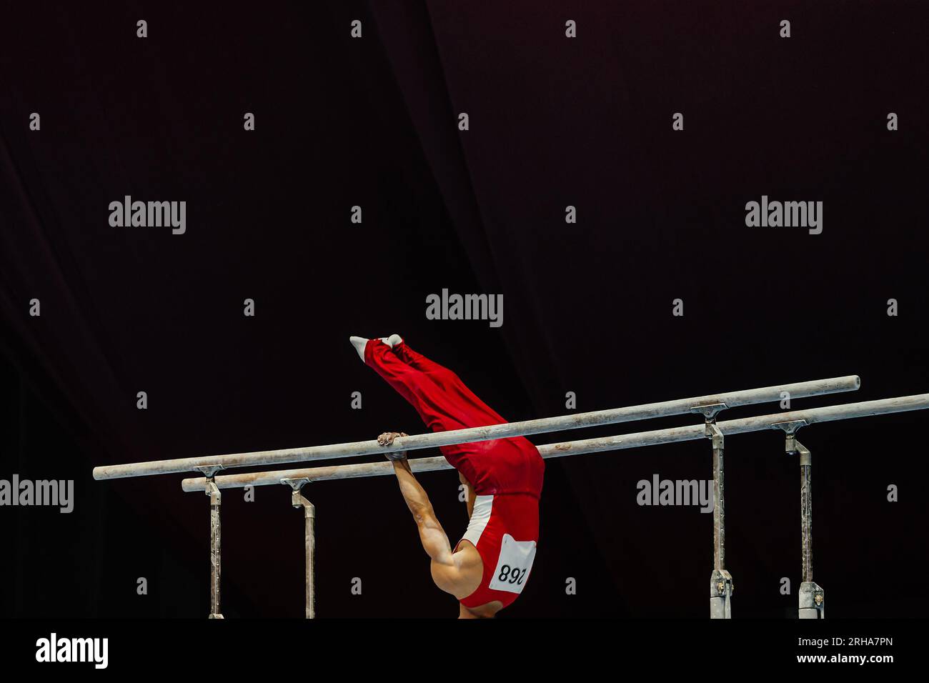 gymnast exercise parallel bars in championship gymnastics, element zhou shixioug Stock Photo Alamy