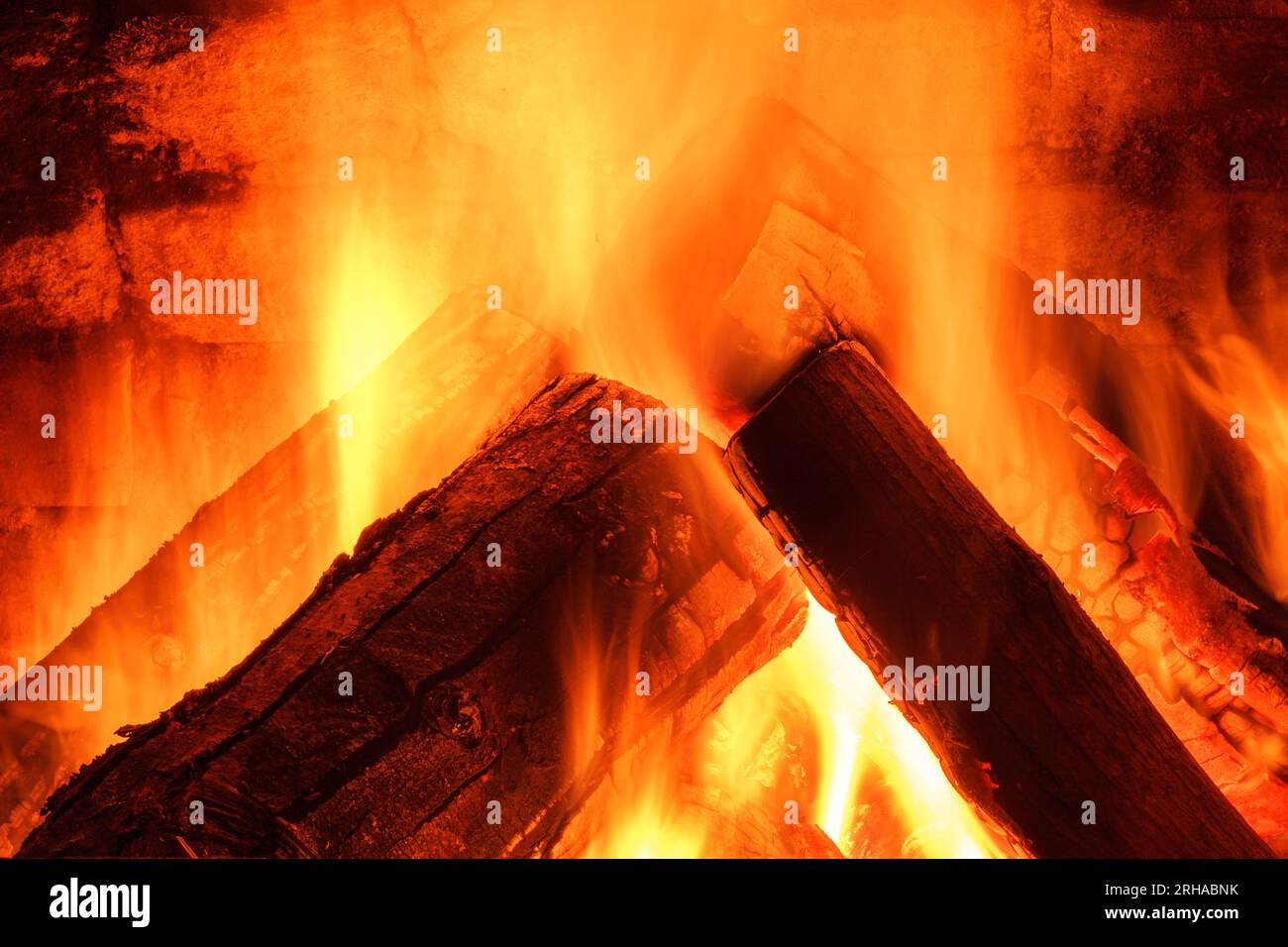 Wood burning in fireplace. Fire keep warm. Crest of flame on burning