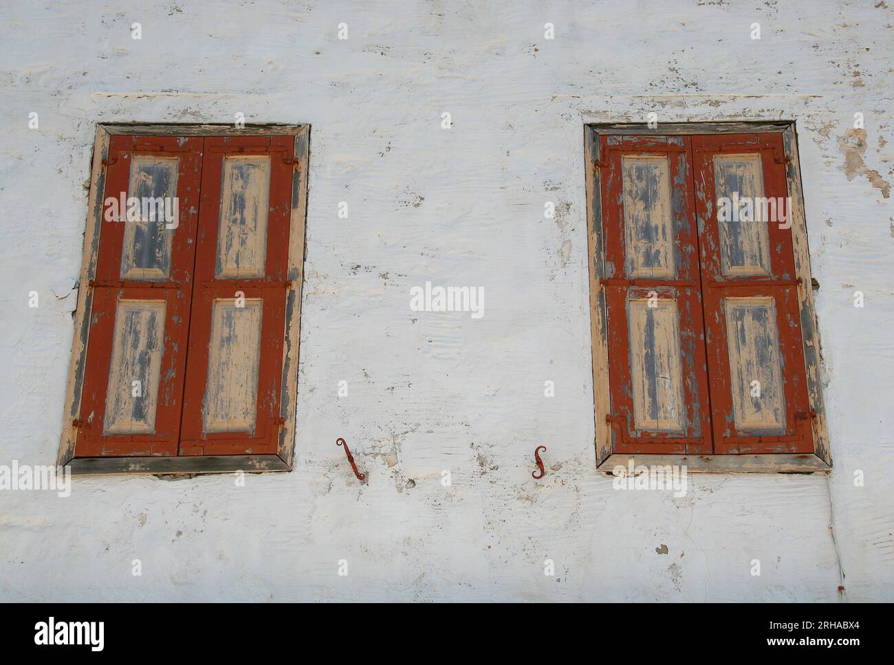 Old Greek House with Old Window Shutters in Symi, Greece Stock Photo ...