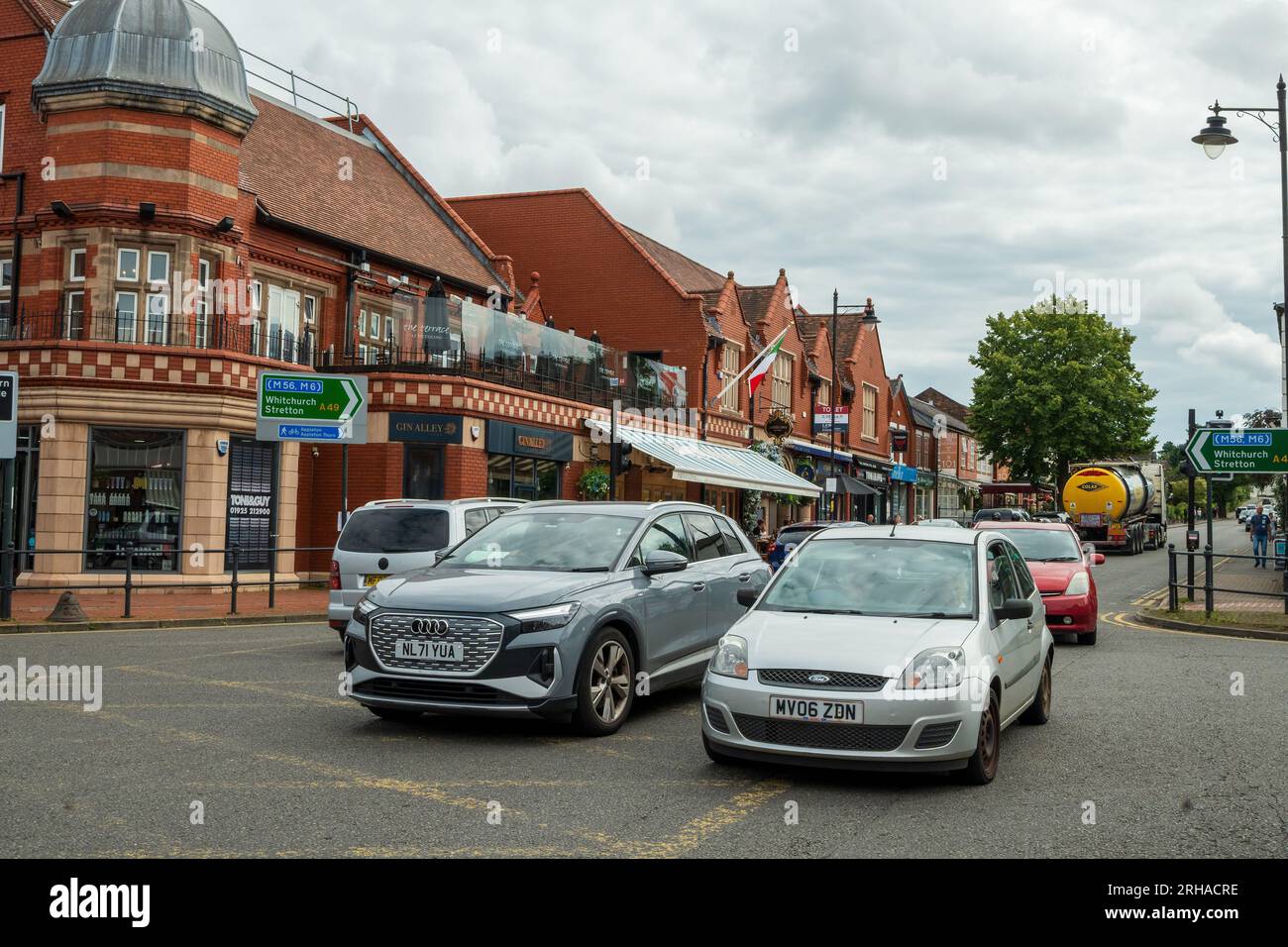 London Road in the centre of traffic busy Stockton Heath a district of Warrington. Stock Photo