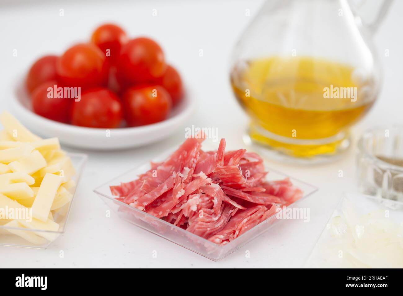 Salami pizza topping ingredients. Pizza preparation Stock Photo Alamy