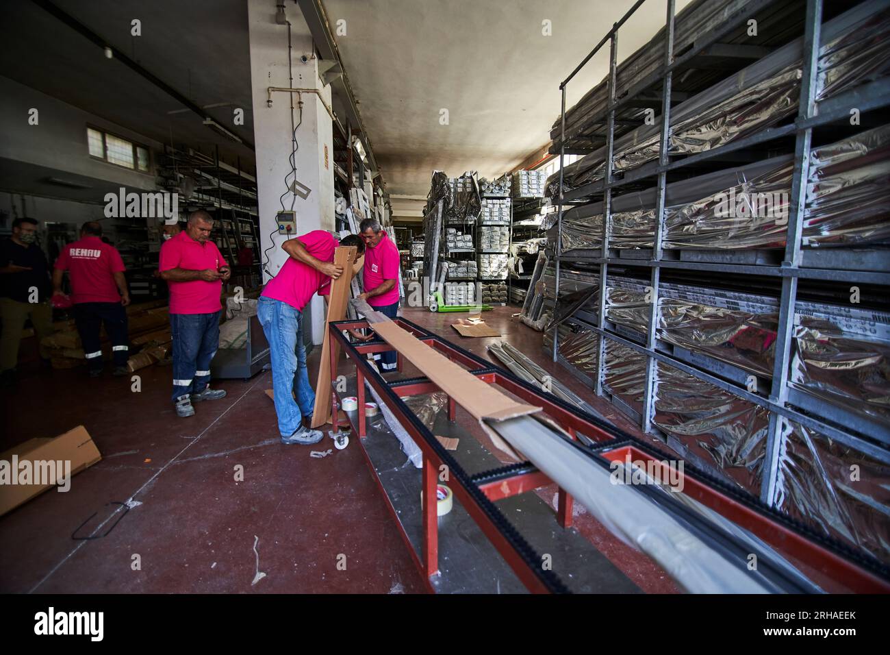 Workers packing cardboard box in warehouse for shipment. an operator ...