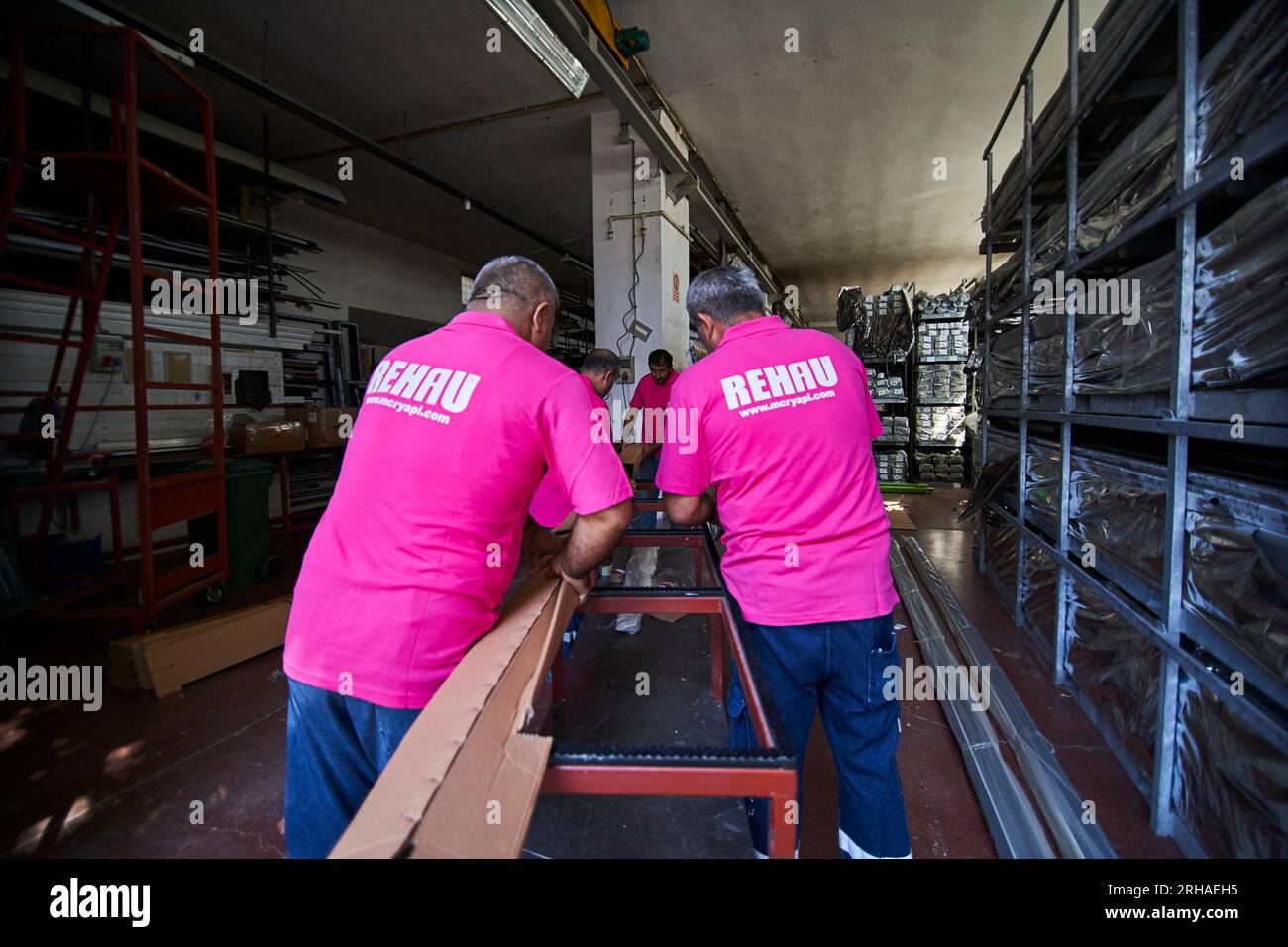 Workers packing cardboard box in warehouse for shipment. an operator ...