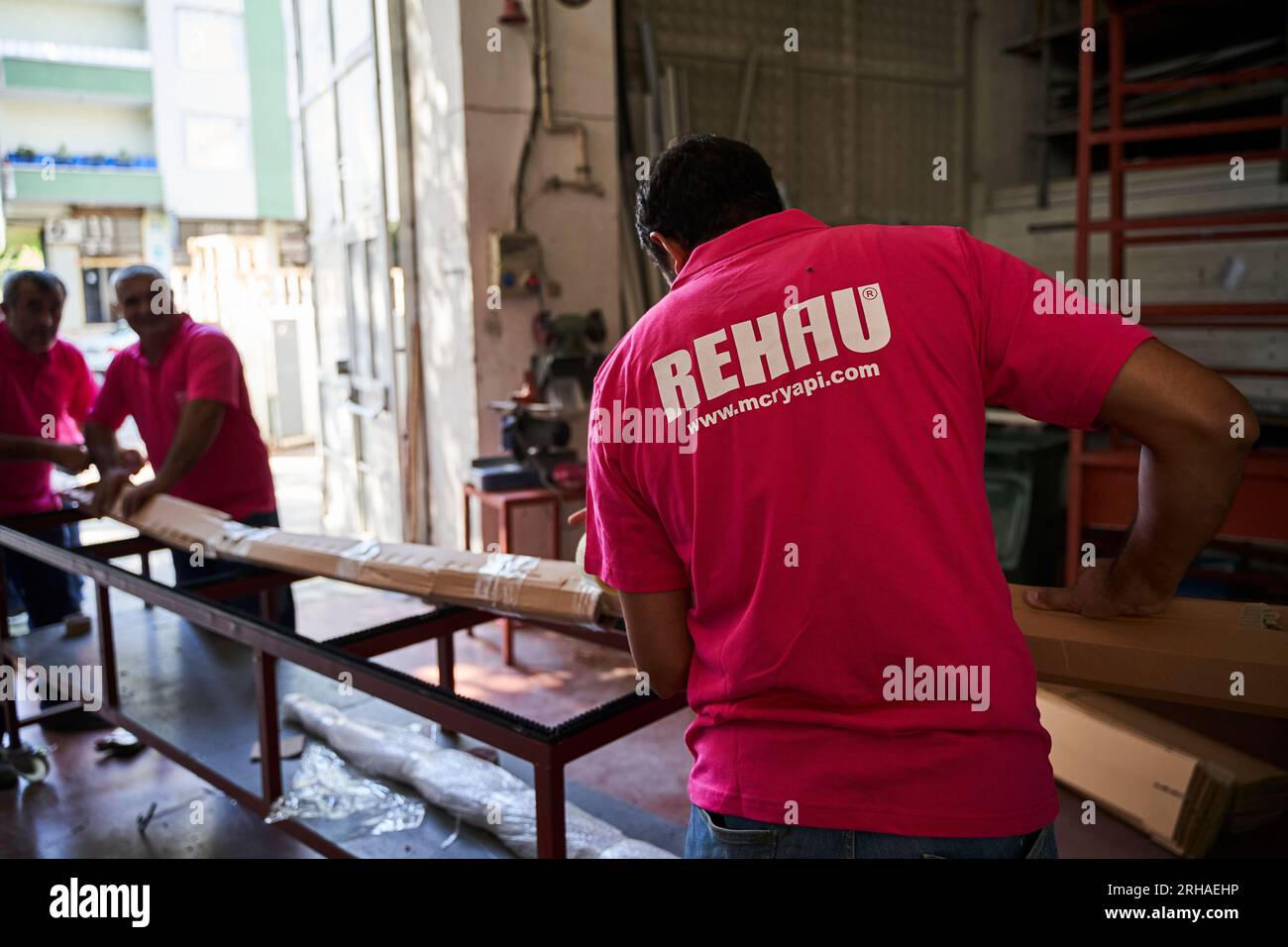 Workers packing cardboard box in warehouse for shipment. an operator ...