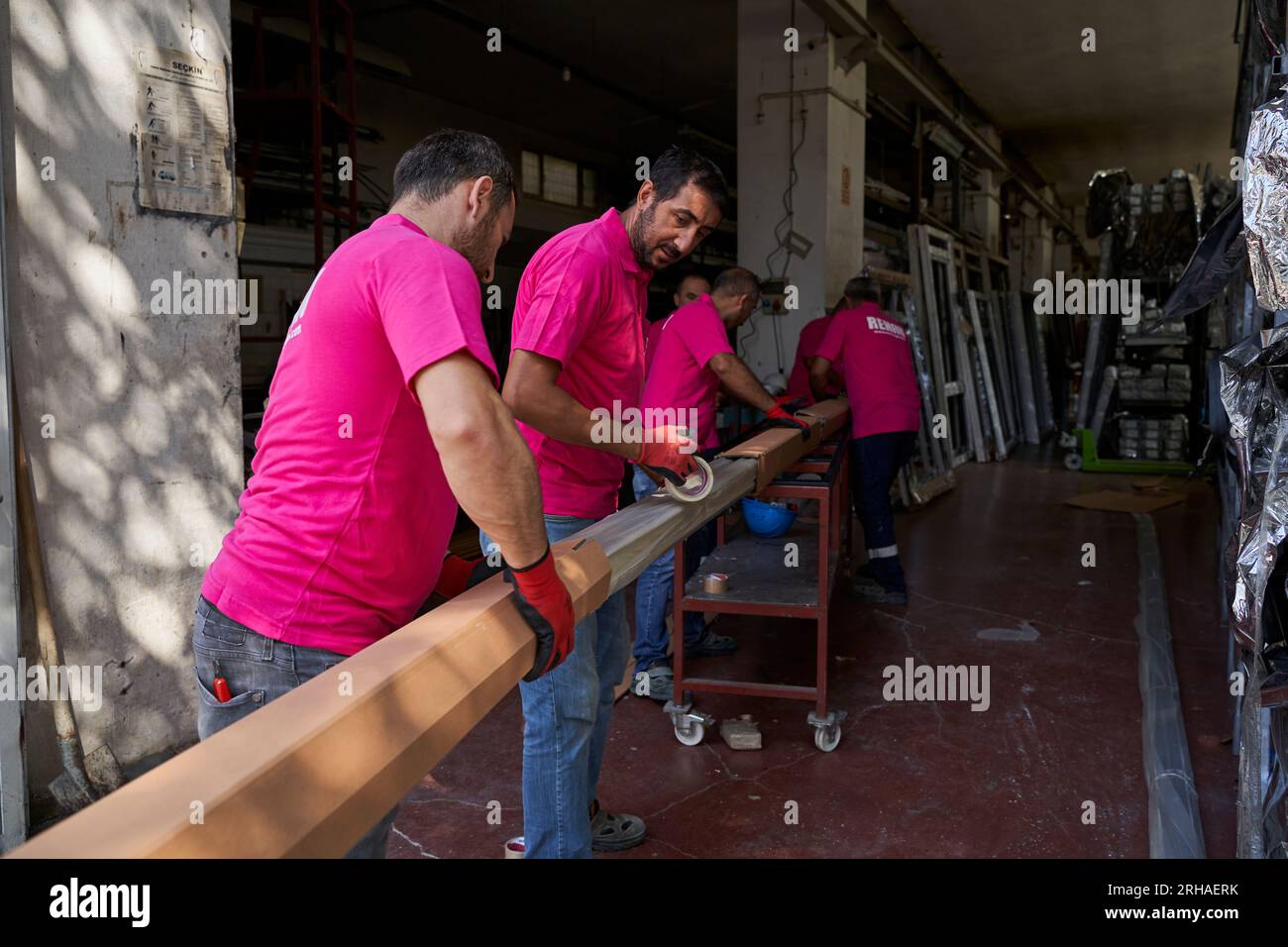 Workers packing cardboard box in warehouse for shipment. an operator ...