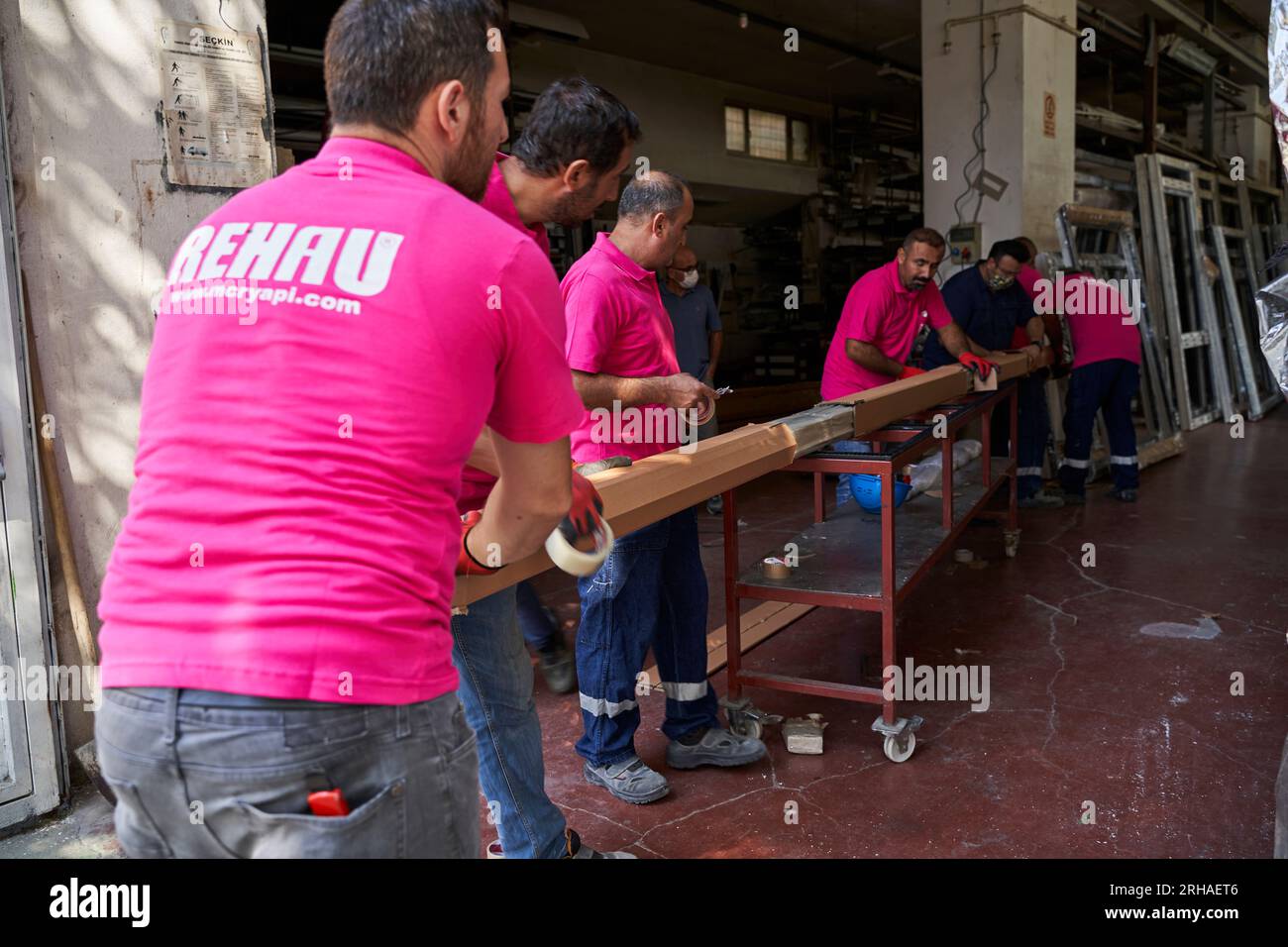 Workers packing cardboard box in warehouse for shipment. an operator ...