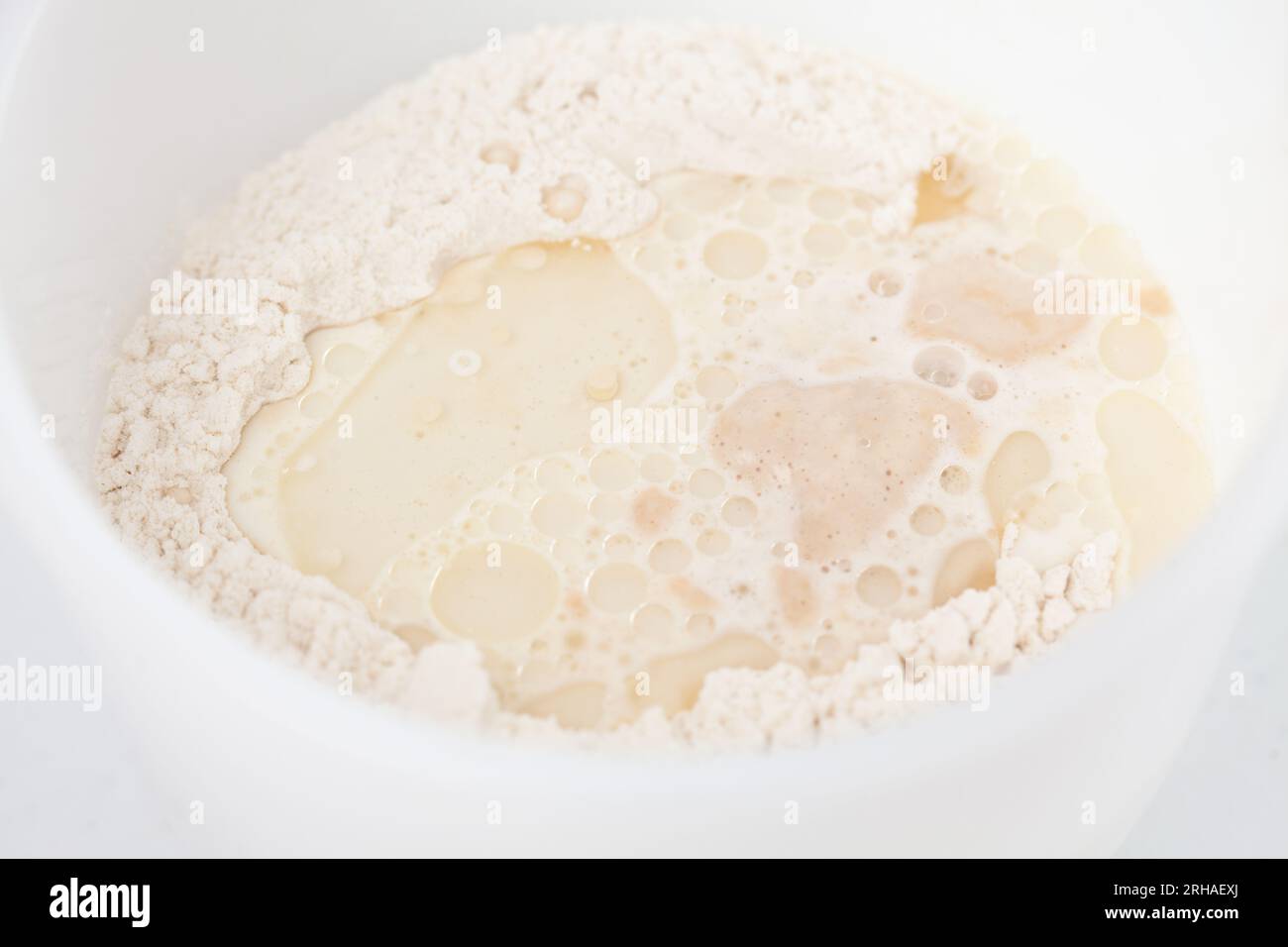 Adding leavened yeast. Home made pizza dough preparation. Pizza