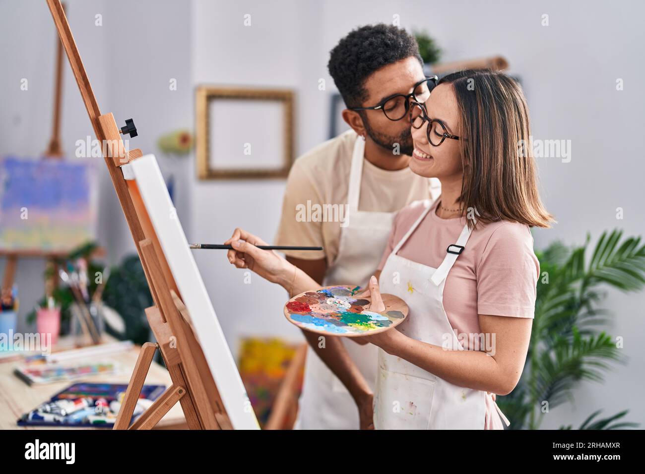 Man and woman couple smiling confident drawing at art studio Stock ...