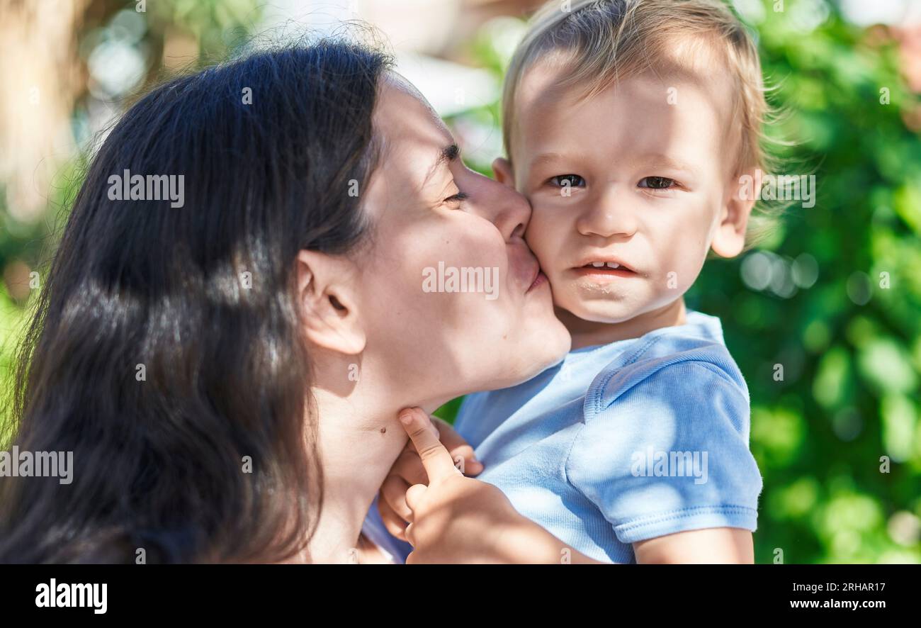 Photo inspiration: Mother And Son Smiling Confident Kissing At Park Stock Photo Photo Inspiration