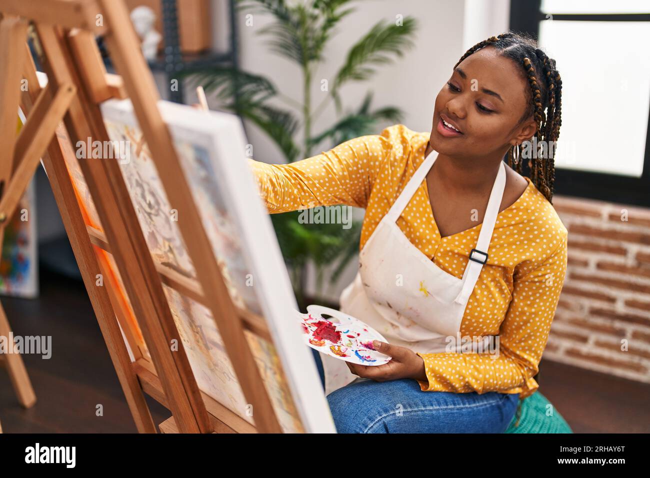 African american woman artist smiling confident drawing at art studio ...