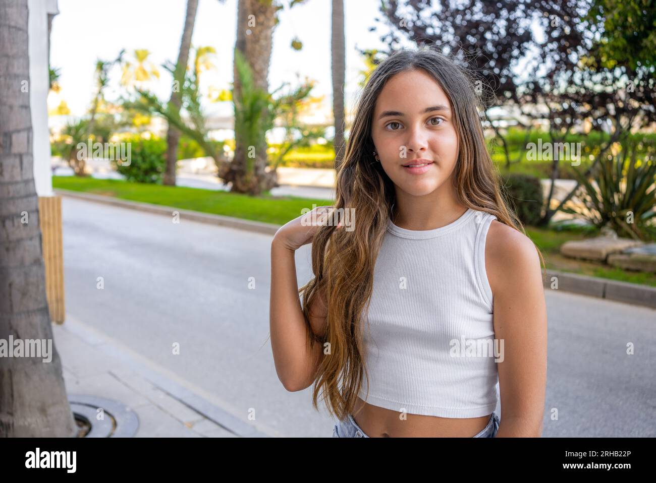 Outdoor portrait of 12 years old girl with long hair Stock Photo - Alamy