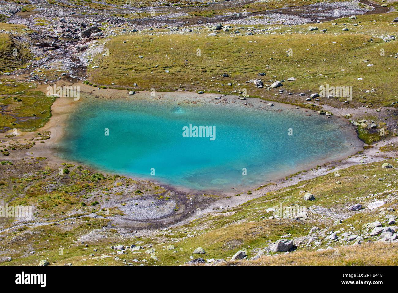 Stunning small blue lake near the Schwarzhorn mountain in swiss alps, Switzerland Stock Photo