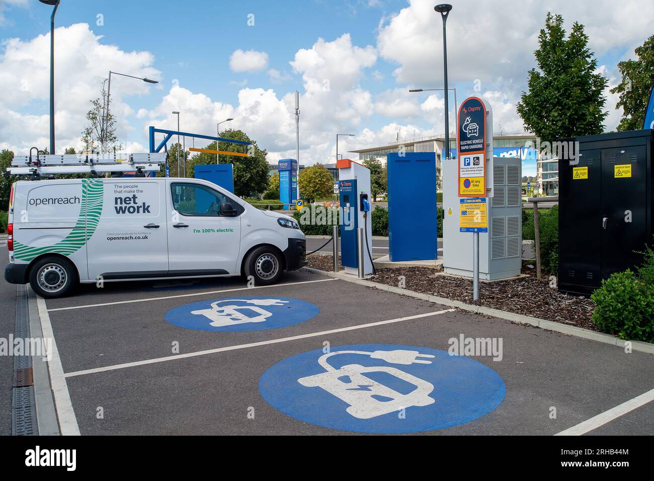 Slough, Berkshire, UK. 15th August, 2023. An openreach 100% electric vehicle on charge at electric vehicle rapid charging points next to the Greggs Drive Thru in Slough, Berkshire. Credit: Maureen McLean/Alamy Live News Stock Photo