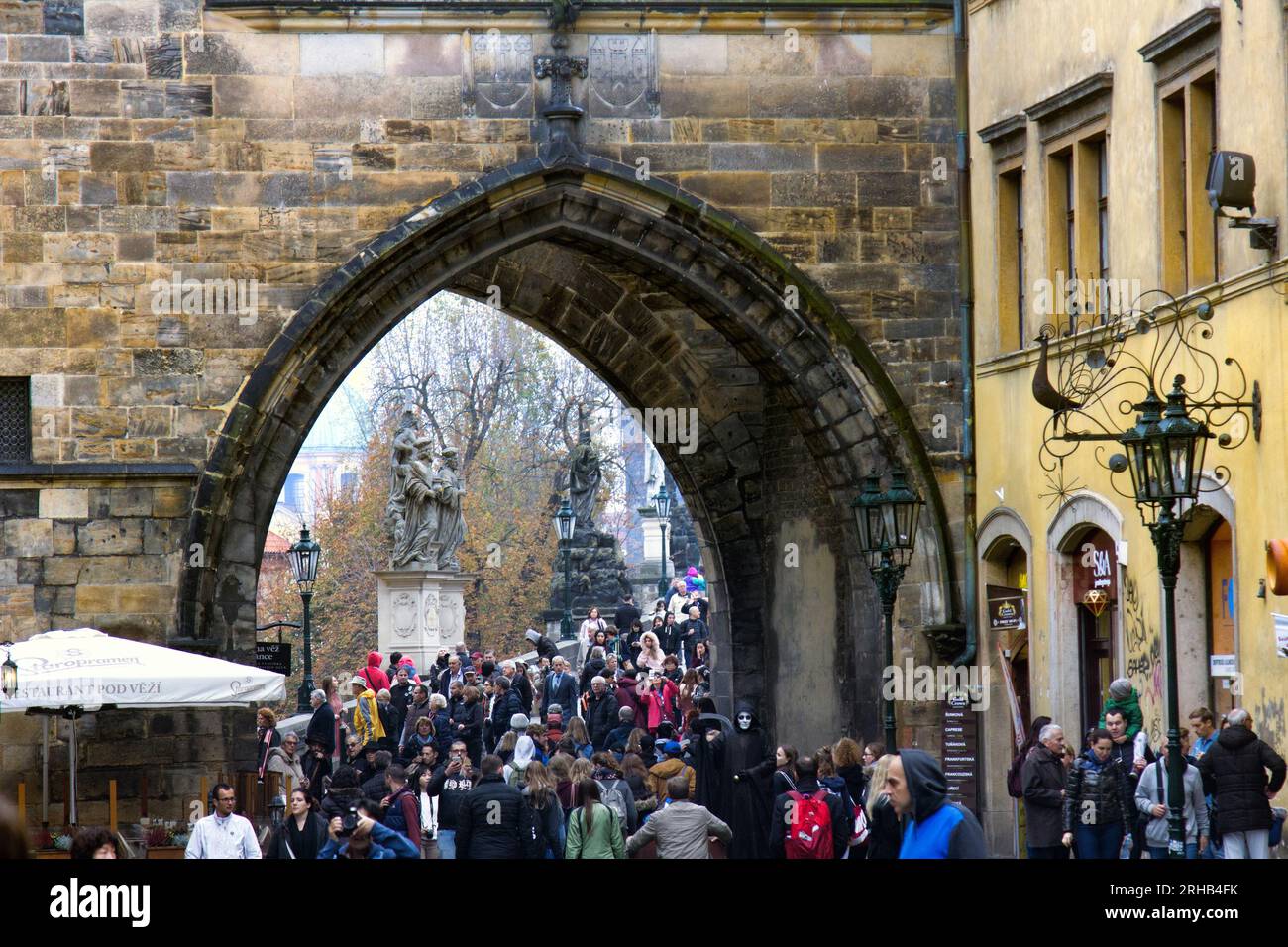 Prague, Czech Republic, Na Kampe - October 19, 2017: Arch in the bridge tower and the many tourists in winter tourist season. Stock Photo