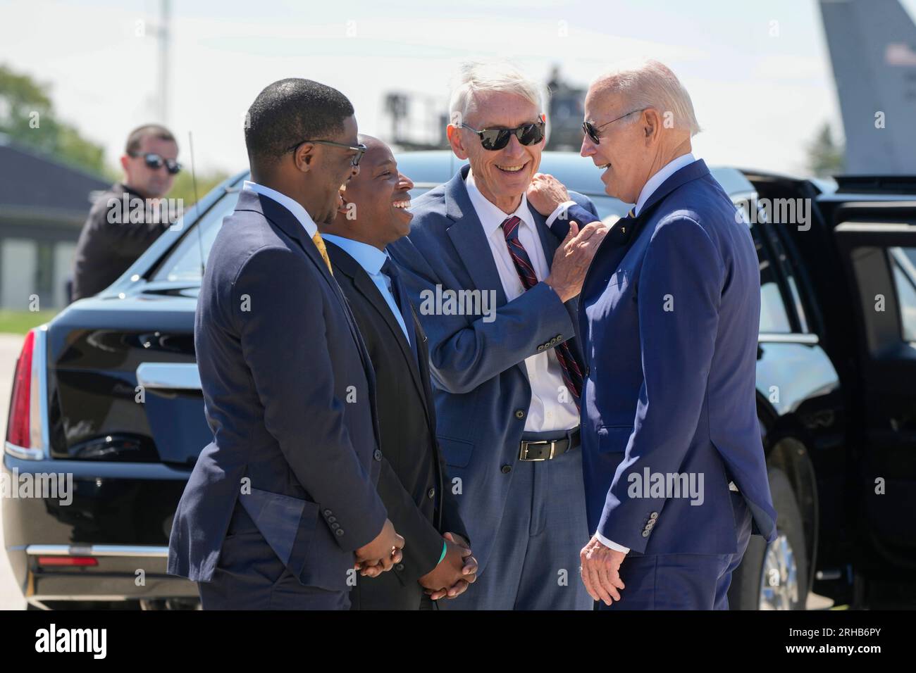 President Joe Biden is Crowley, Milwaukee Gov. Air David Evers, Mayor right, One International Milwaukee he as Cavalier Force Wisconsin on Johnson, County, Executive Milwaukee from Tony greeted and arrives by, at