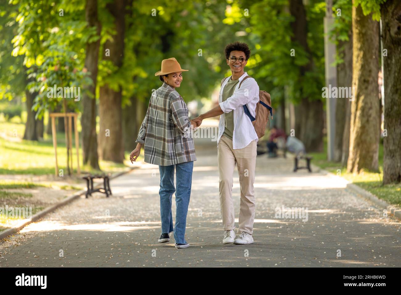 Cute couple spending time together in the park and looking happy Stock ...