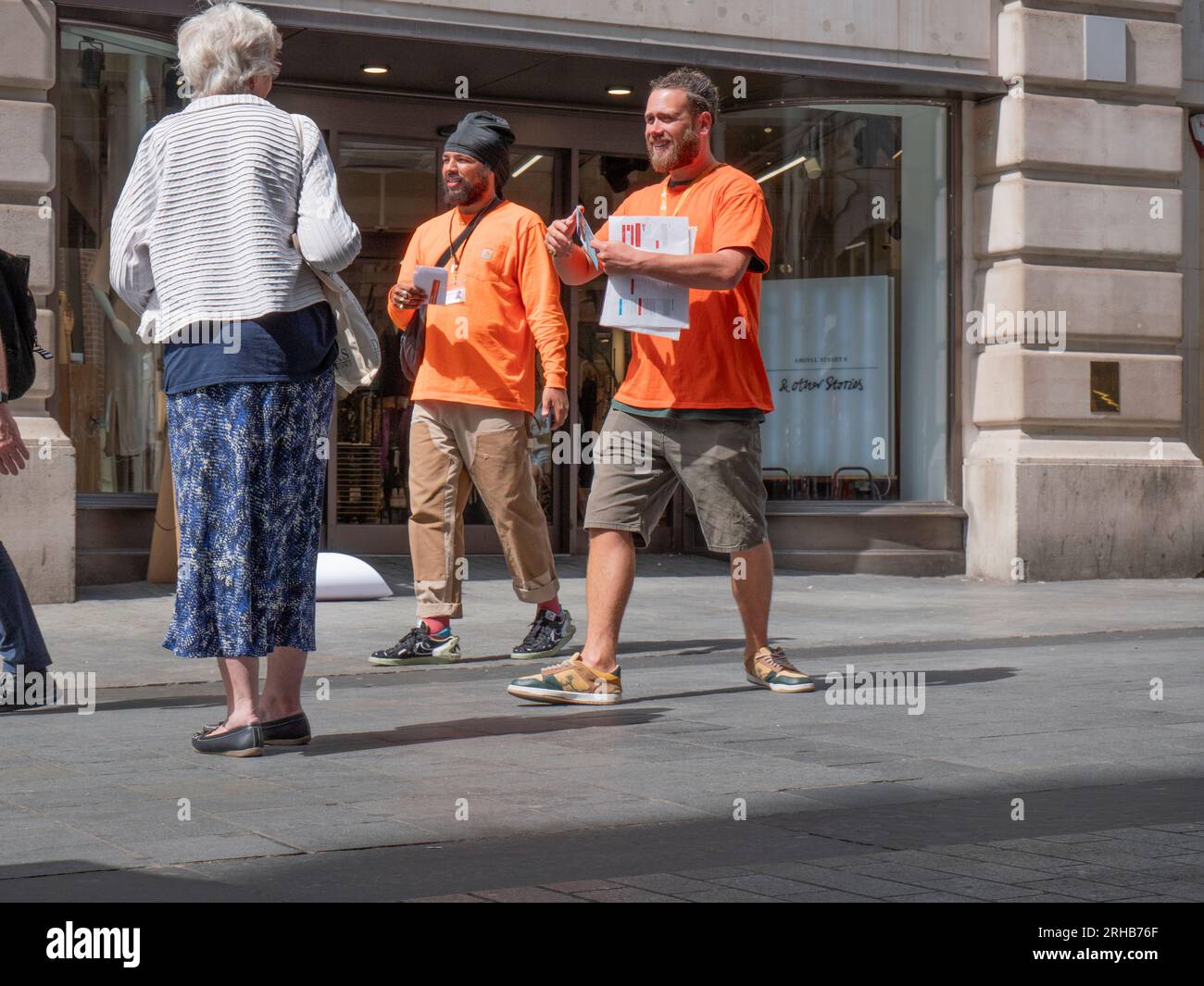 face to face chugger, Street Charity Collector, collecting in Central London for the CentrePoint homeless charitable organisation Stock Photo