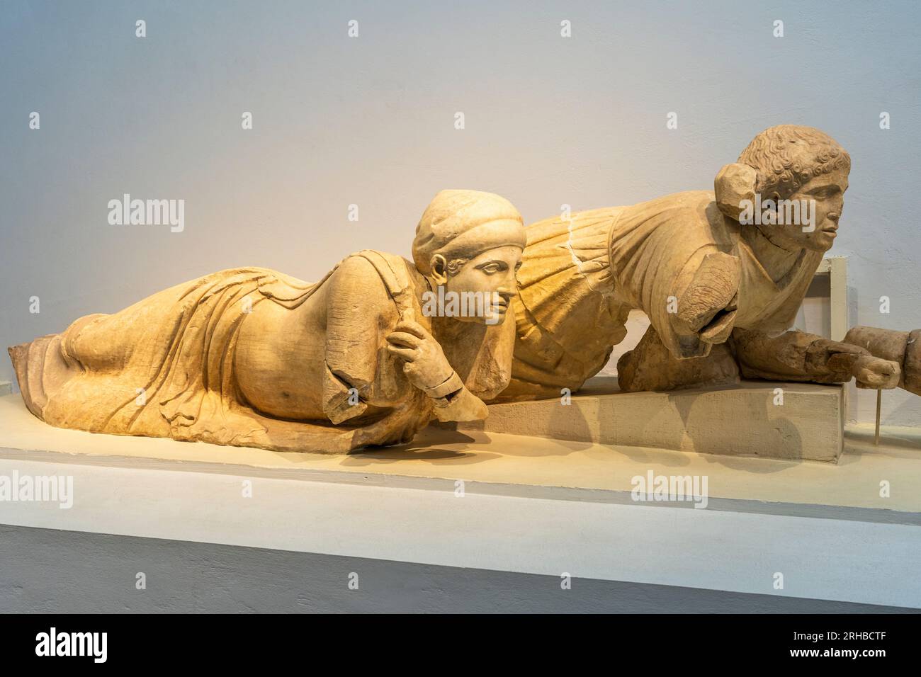 Two lying women from the pediment frieze of the Temple of Zeus on display at the Archaeological Museum at ancient Olympia, Elis, Peloponnese, Greece Stock Photo