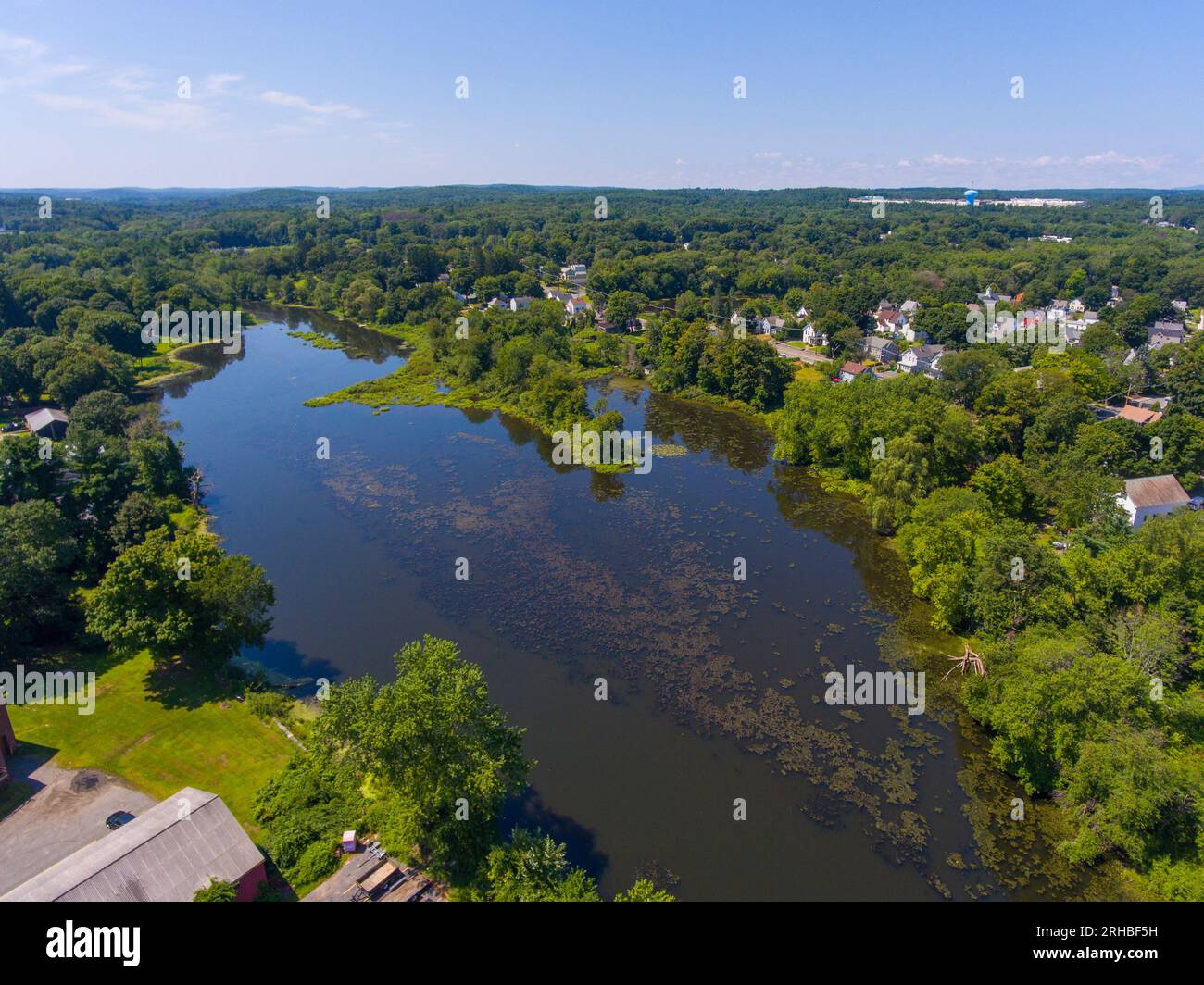 Assabet River aerial view in summer near historic town center of Hudson, Massachusetts MA, USA. Stock Photo