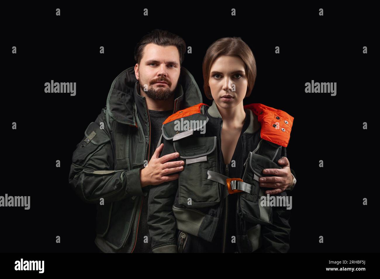 Hugging couple on a black background. Support concept. Stock Photo