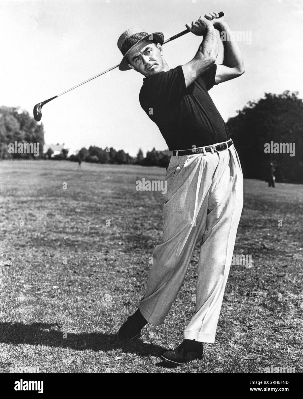 United States:  c. 1950 Sam Snead at the end of a golf swing. Stock Photo