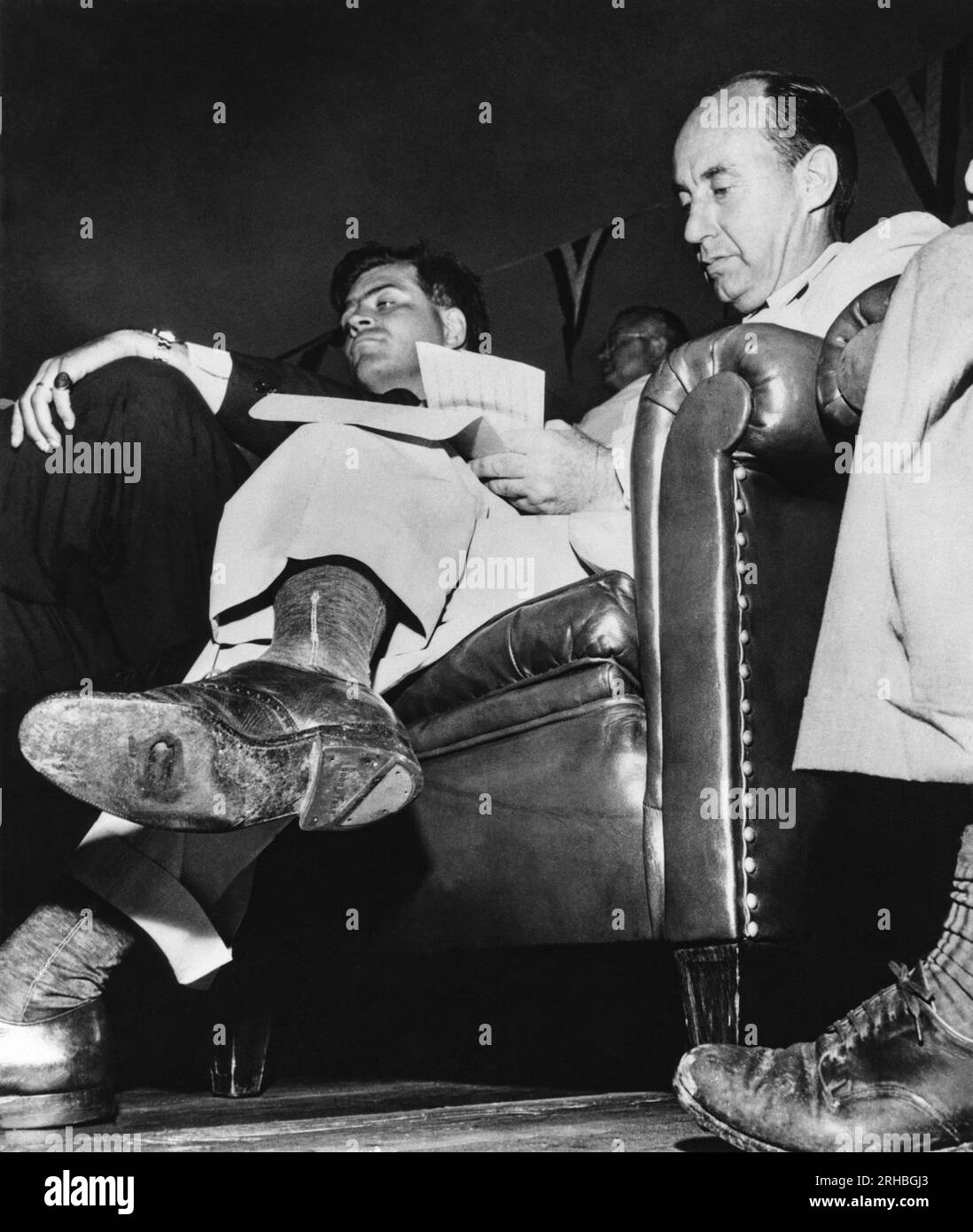 Michigan:  1952 Adlai Stevenson at a Presidential campaign stop in MIchigan whenn he crossed his leg revealing a hole in the sole of his shoe. The photograph won a Pulitzer Prize for photographer William Gallagher. Stock Photo