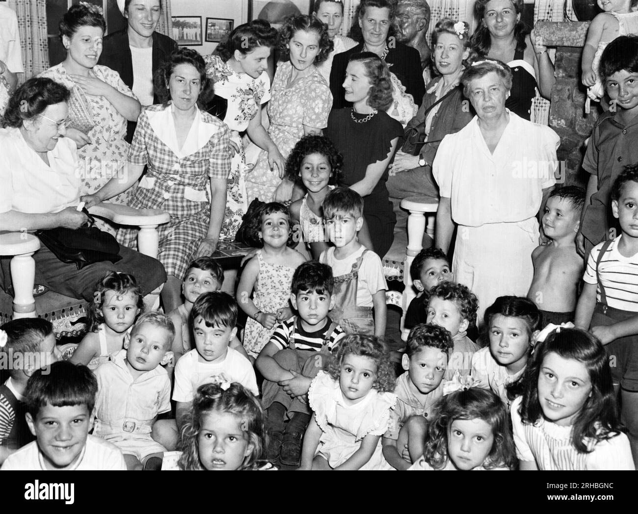 Hyde Park, New York:  August 10, 1946 Eleanor Roosevelt with a group of World War II widows and their children at her Hyde Park estate where she invited them for a picnic today. Stock Photo