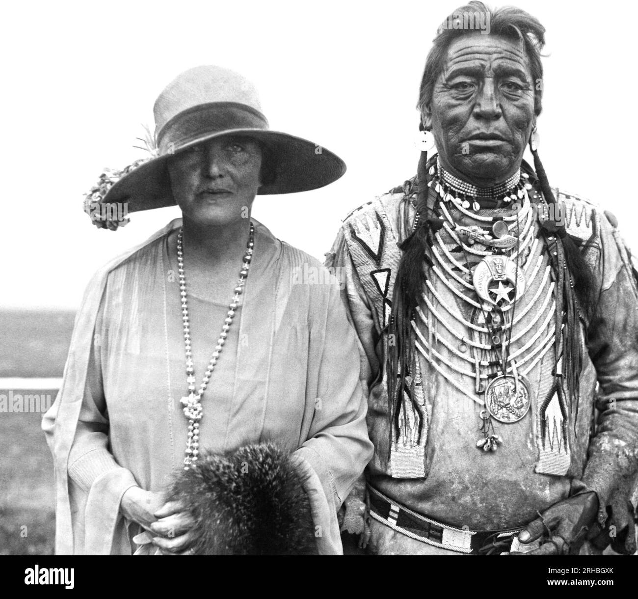 Washington, D.C.:  1927 Author Mary Roberts Rhinehart with Blackfoot Chief Two Guns White Calf at the Indian celebration being held at  Griffith Stadium. Stock Photo